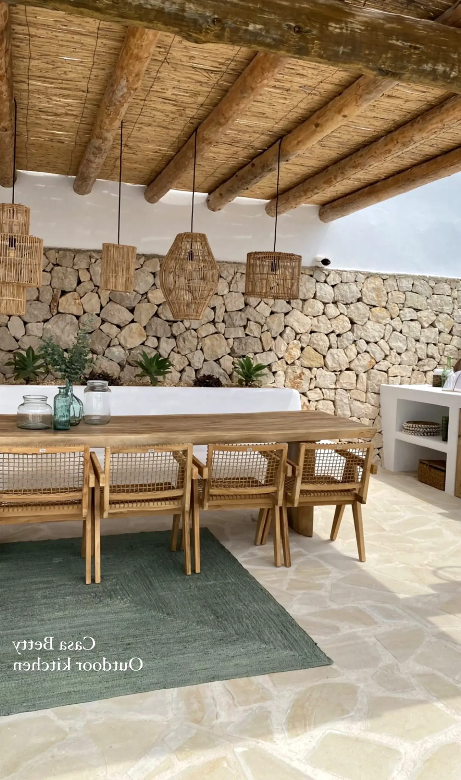 Relaxed porch bench supports the composition through light, leaving the space feeling personal and relaxed.