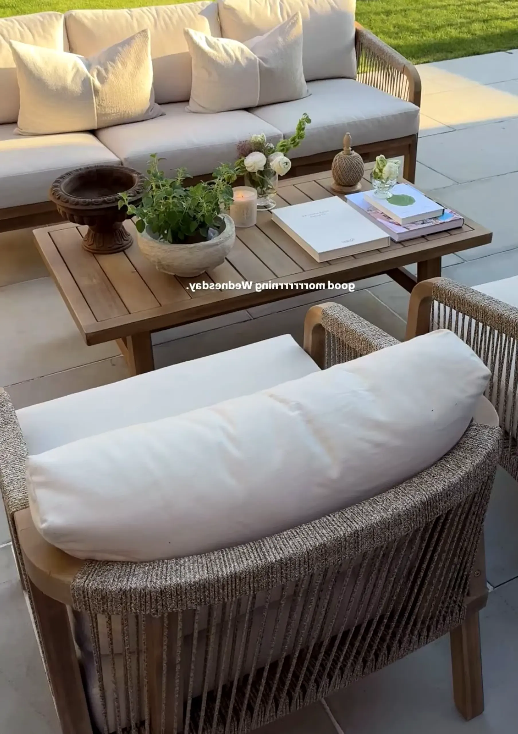 Natural woven chair adds a clear layer of light, helping the room feel visually grounded.