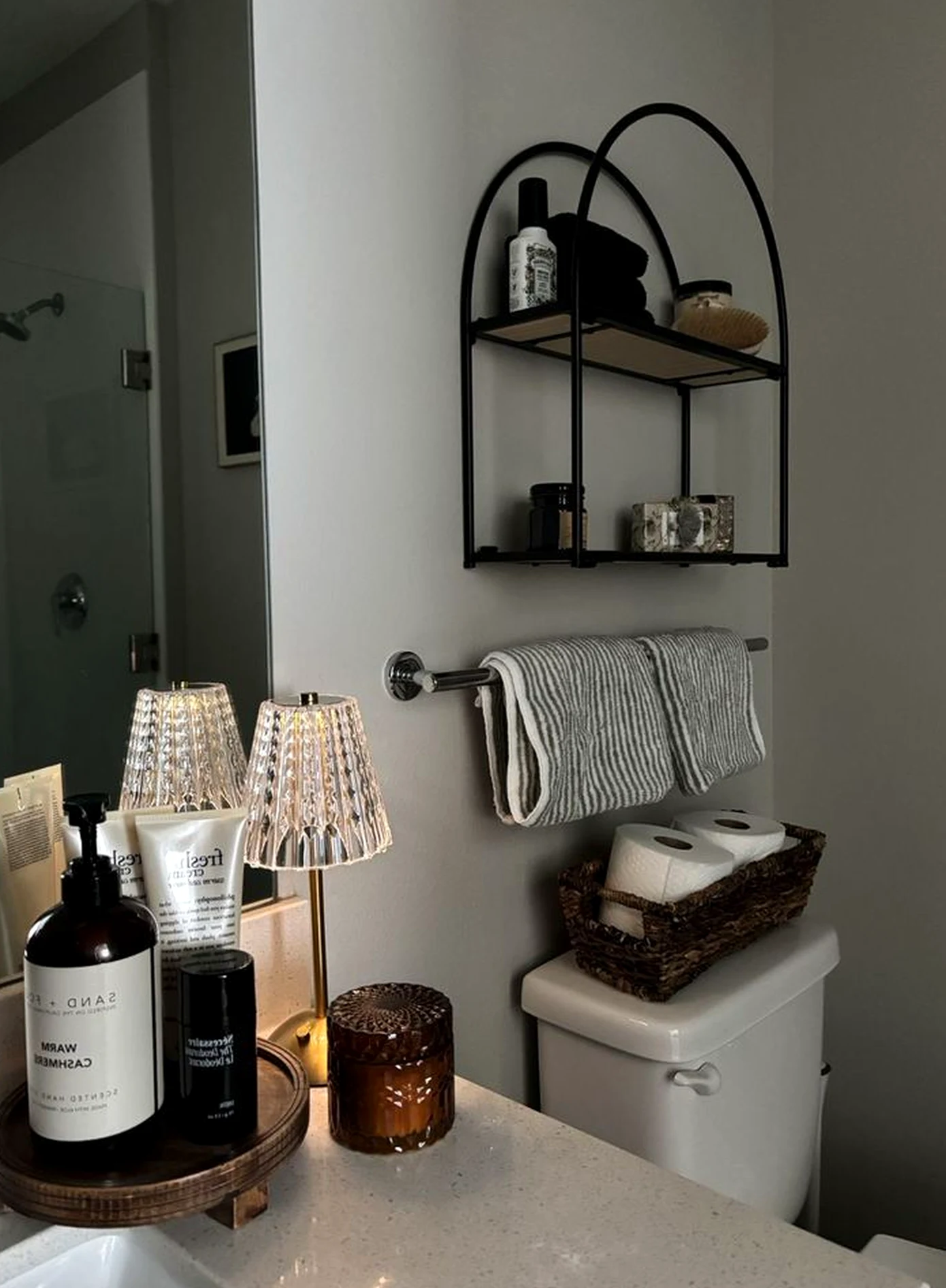 Simple wall niche brings ease to the arrangement, creating a mood that feels warm without clutter.