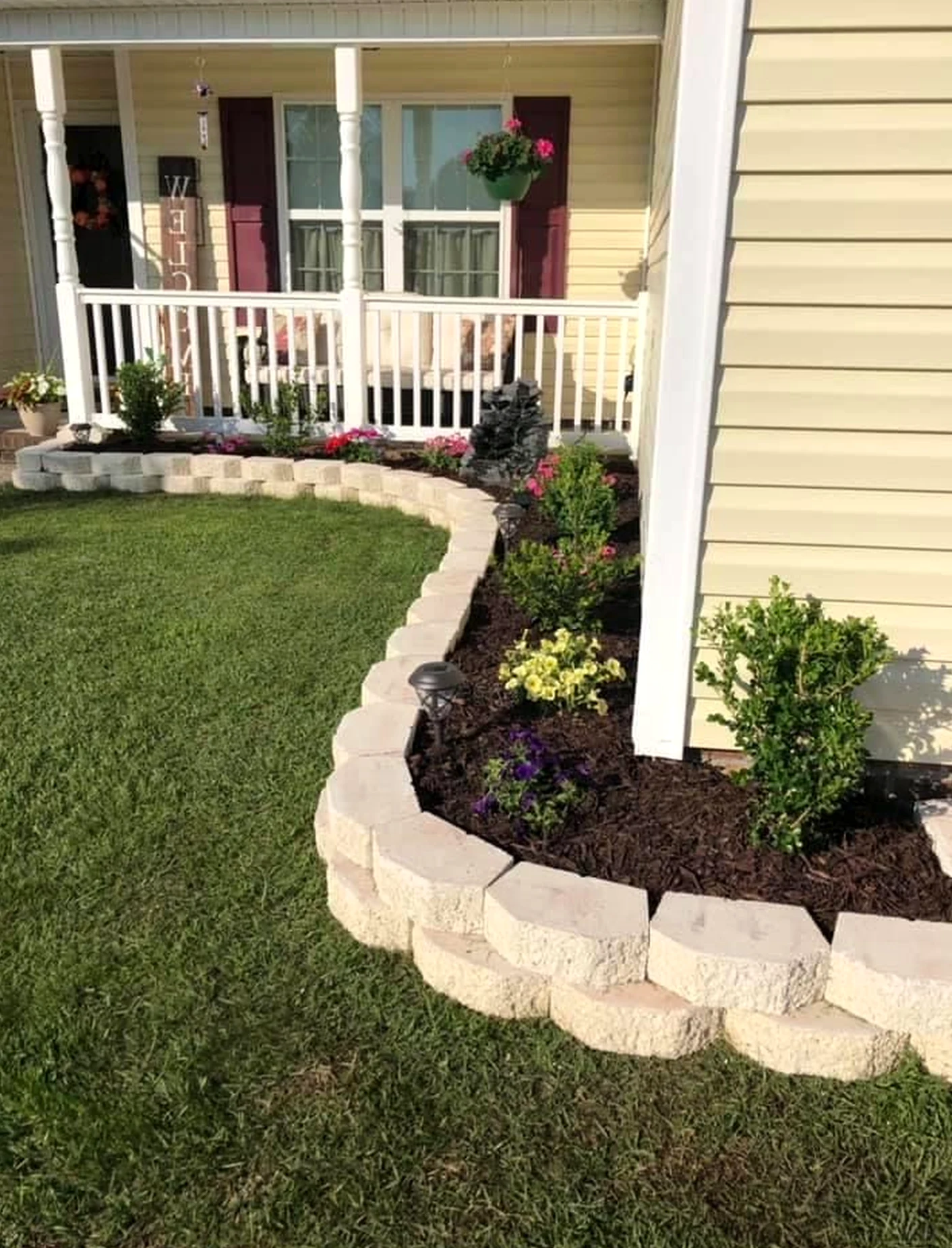 Textured stone terrace brings character to the composition, creating a mood that feels settled and welcoming.
