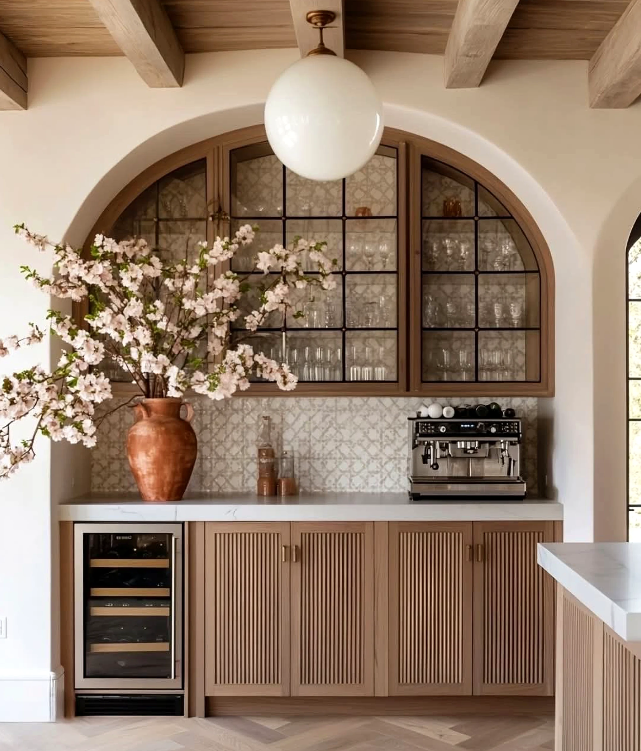 Soft flower arrangement frames the corner with ease, making the scene feel fresh and intentional.
