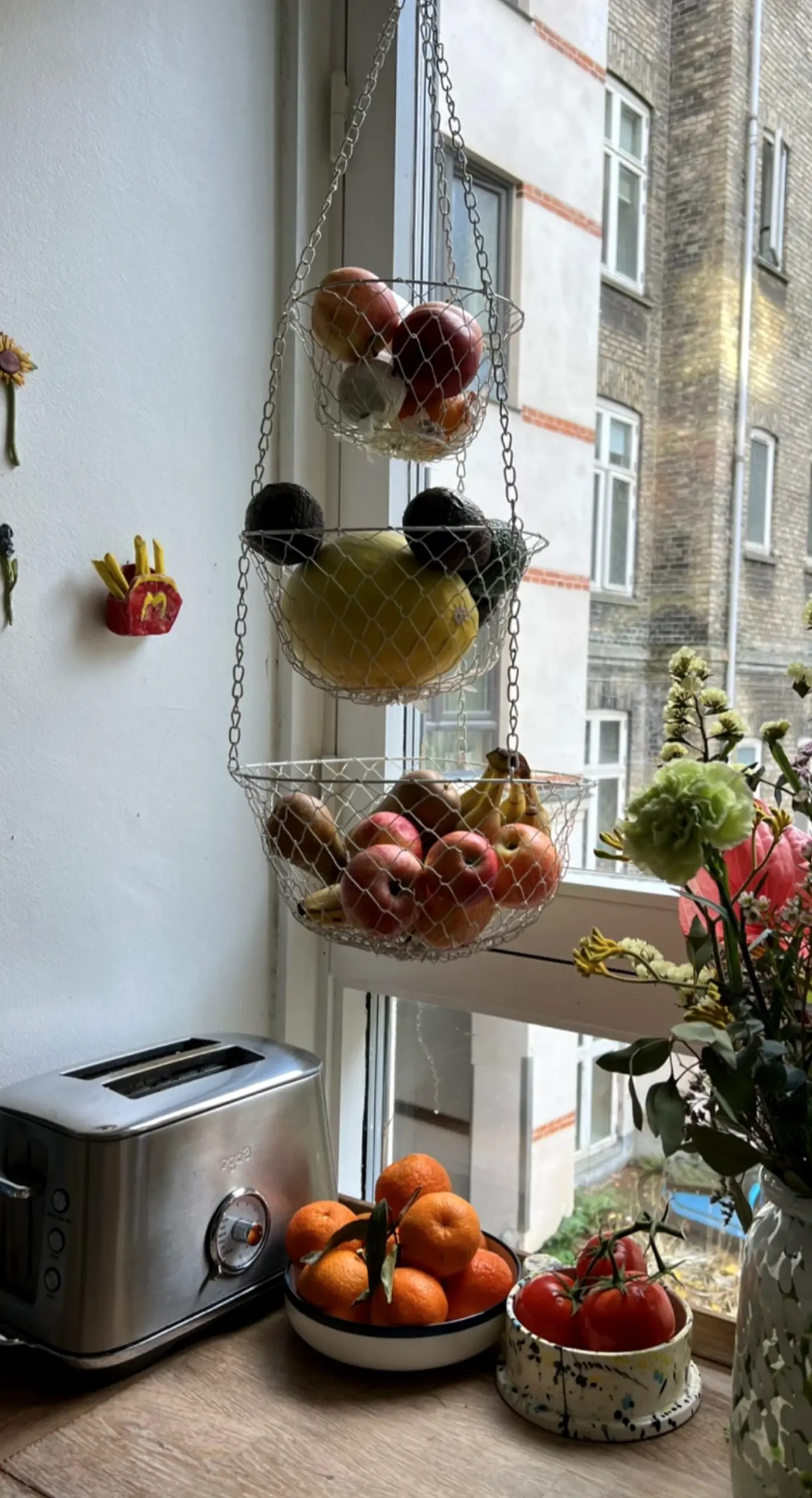 Airy breakfast table adds a clear layer of character, helping the arrangement feel fresh and intentional.