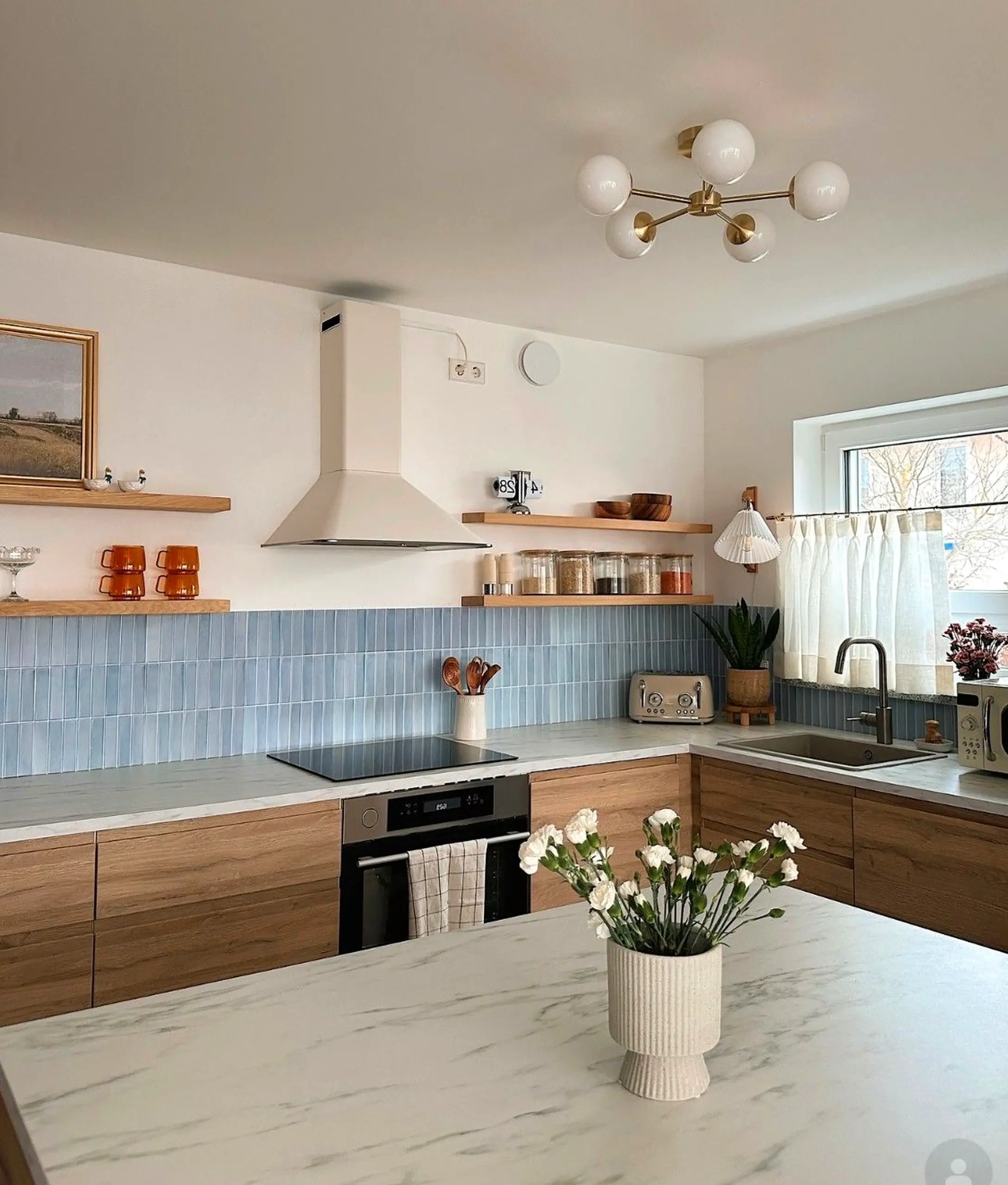 Inviting kitchen nook anchors the wall with rhythm, giving the view a mood that feels ready for quiet use.