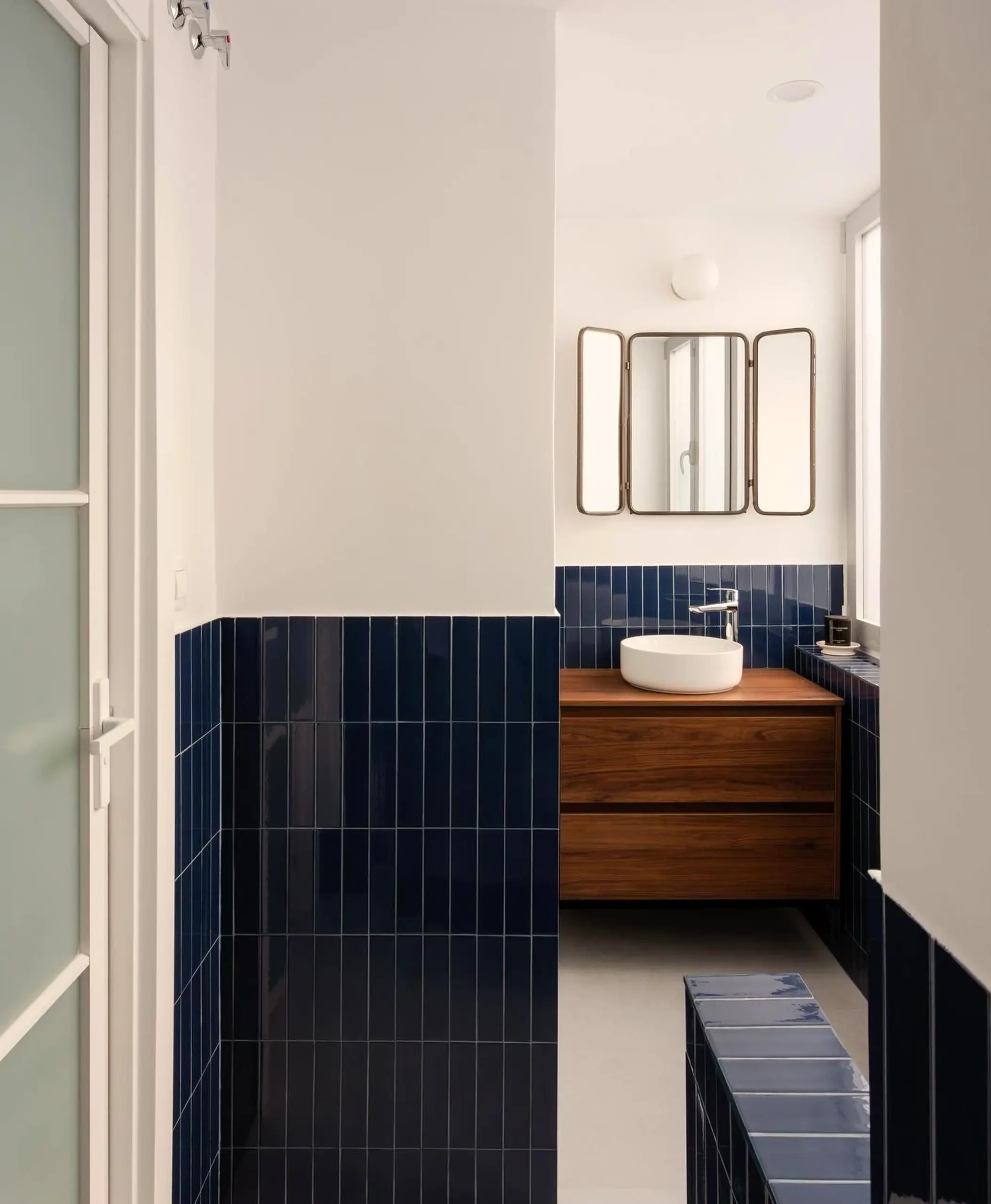 Sunny green entry supports the corner through balance, leaving the space feeling settled and welcoming.